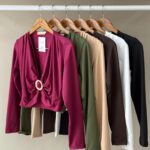 Long-sleeved top with gold buckle