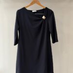 Black dress with brooch detail