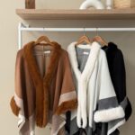 Striped cape with fur collar and cuffs