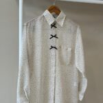 Bow accent polka dot shirt