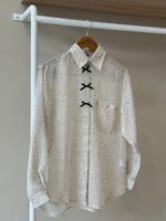 Bow accent polka dot shirt