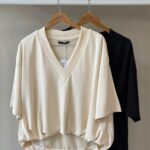 Draped hem v neck top