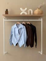 Asymmetrical gold button shirt