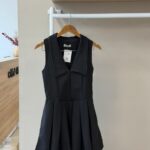 Collared pleated mini black dress