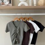 Draped v-neck buckle detail top