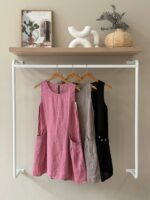 Sleeveless linen dress with button pocket detail