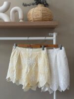 Daisy embroidered linen shorts